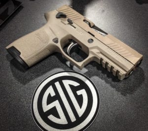 SIG Sauer P320 FDE on SIG logo table