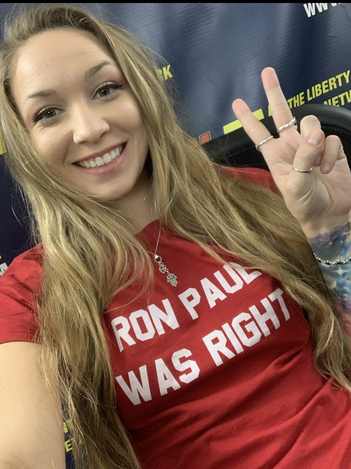 Nikki Sunshine, a smiling young woman in a "Ron Paul was right" t-shirt